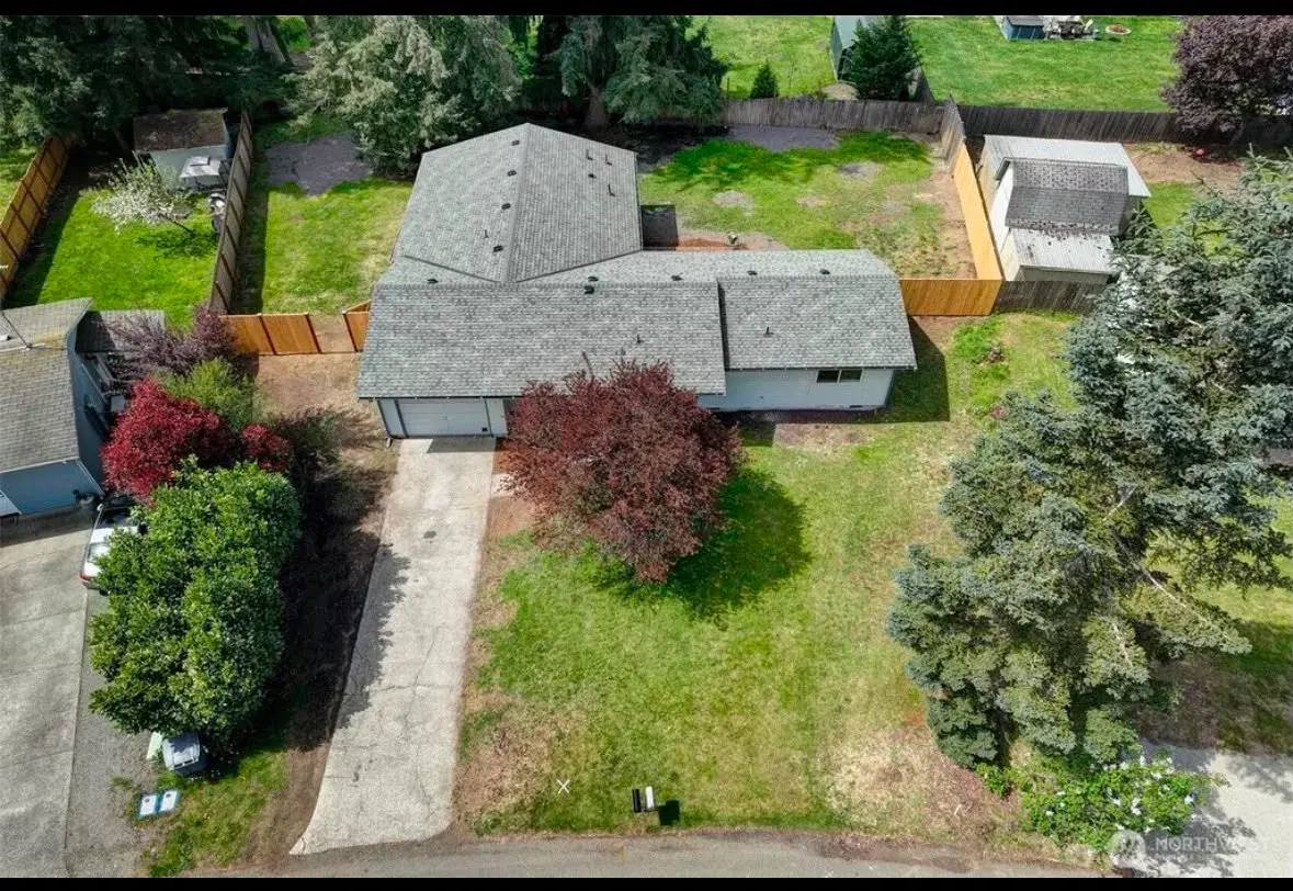 Aerial view of the property and surrounding neighborhood