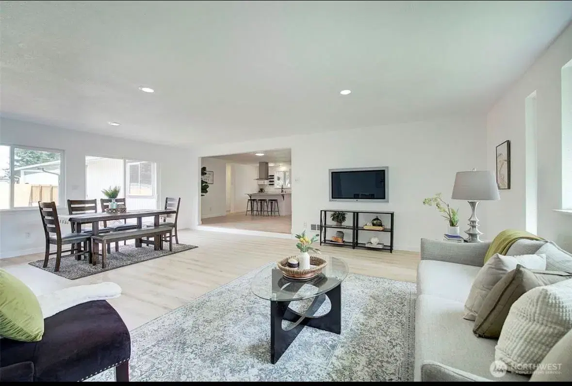 Open living and dining area with view into the kitchen